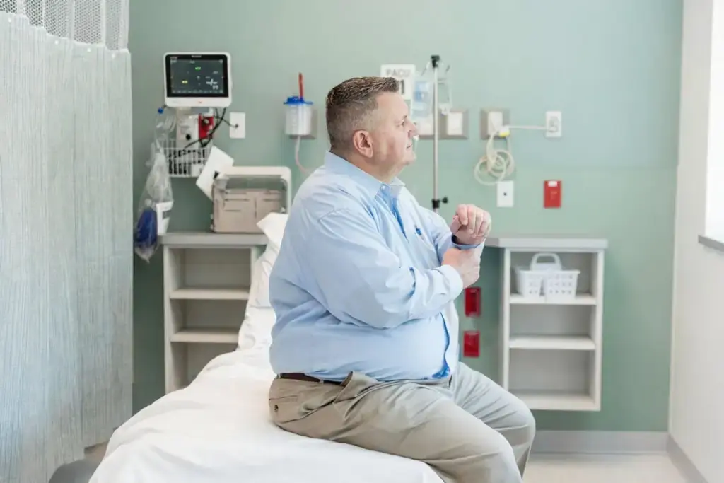 Obese man in hospital room